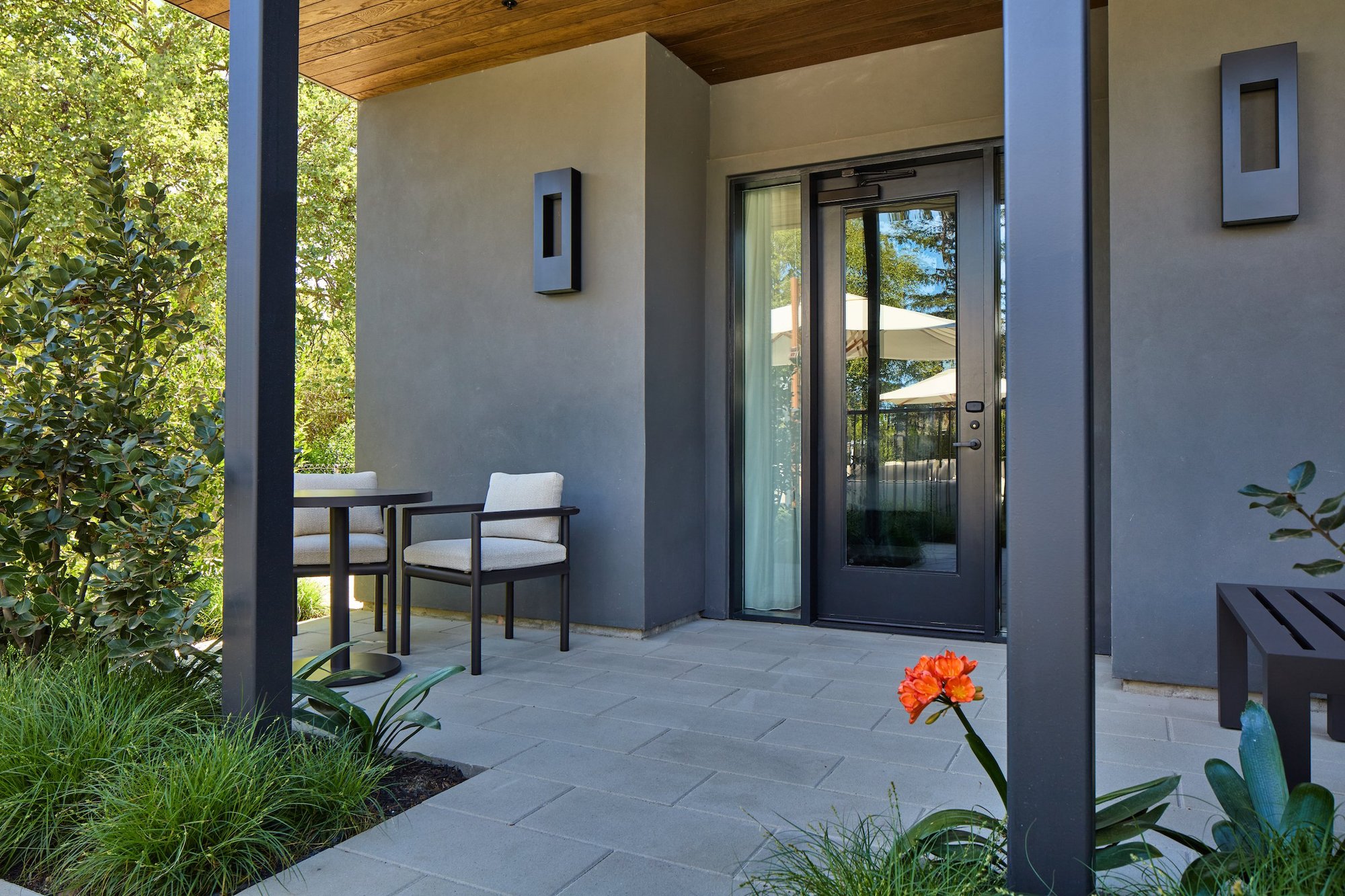 Poolside Garden Level Suite private covered patio and private entry