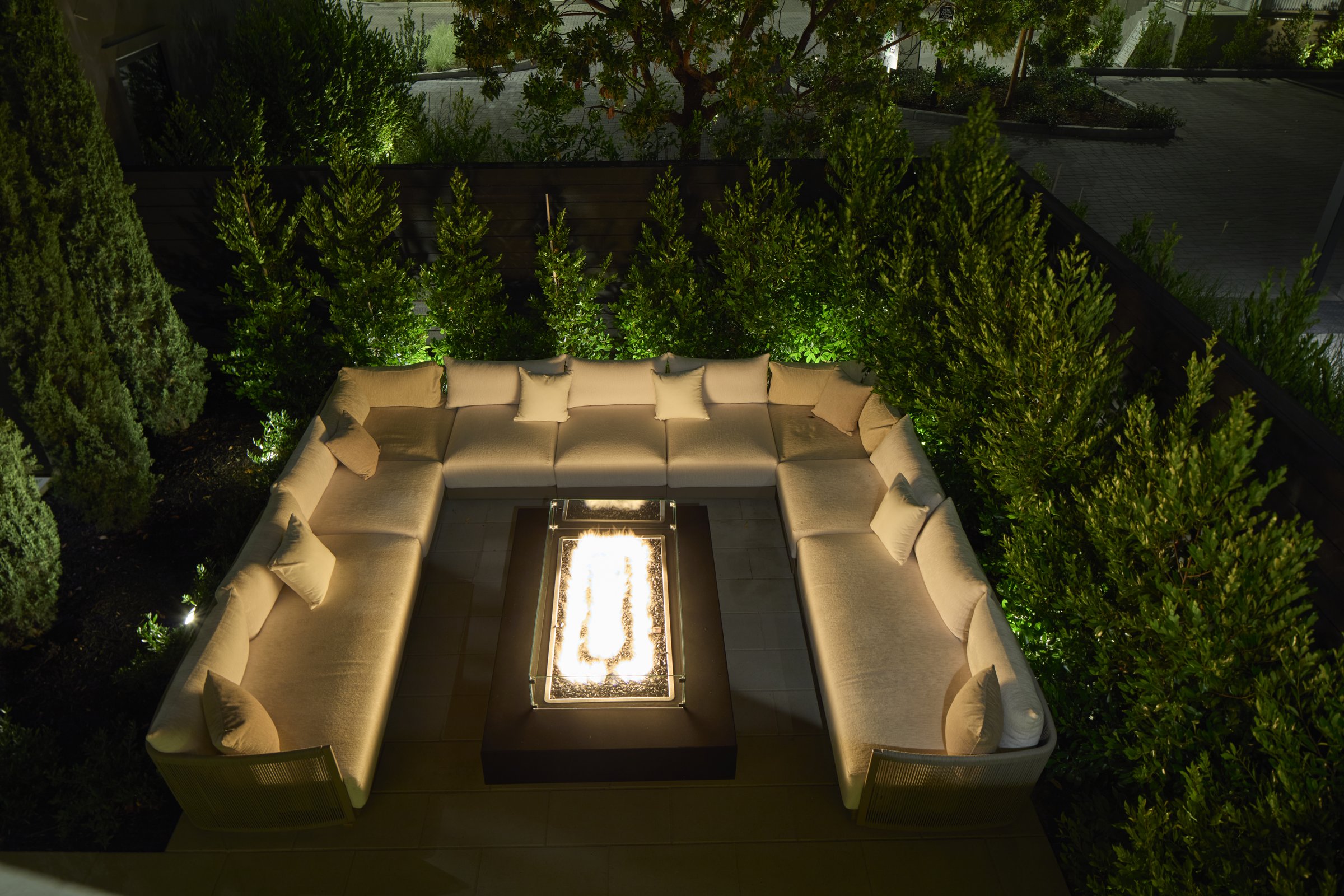 The Afterglow Fire Pit Area from above, seating gathered around the fire at Duchamp Healdsburg.