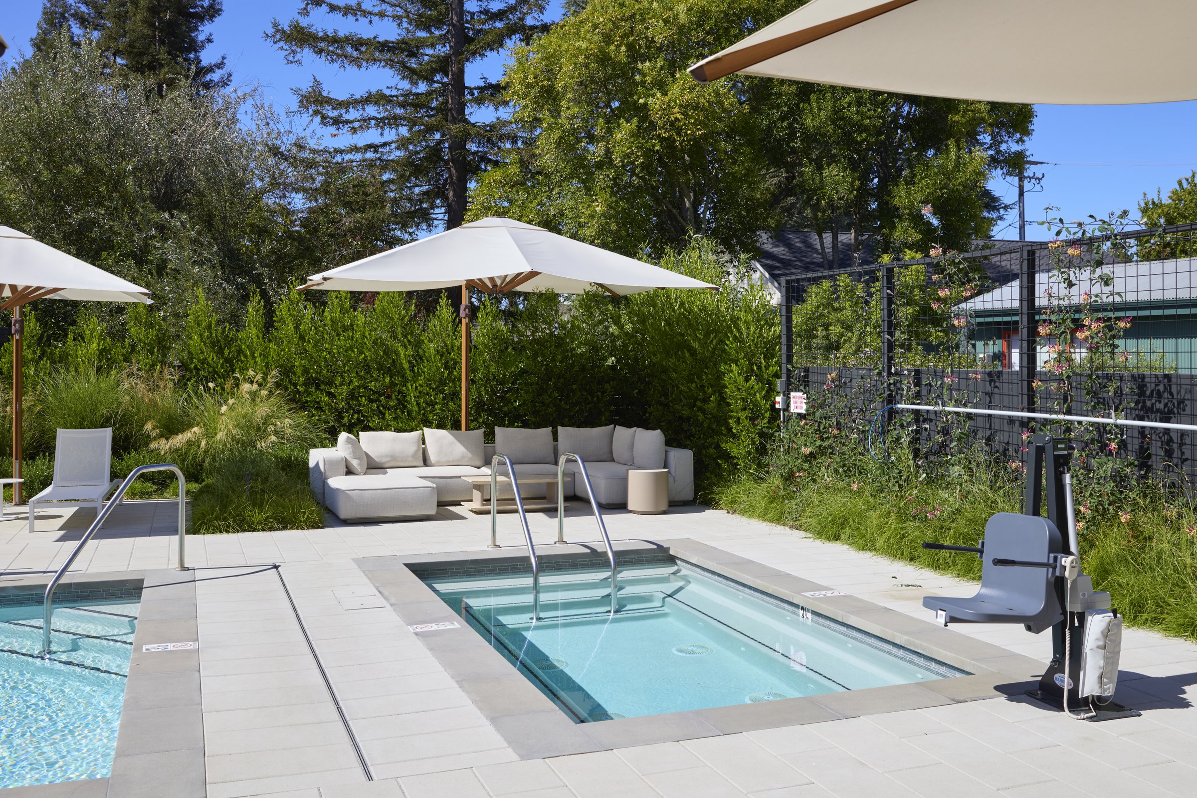 The oversized twelve person spa adjoining the lap pool at Duchamp Healdsburg.