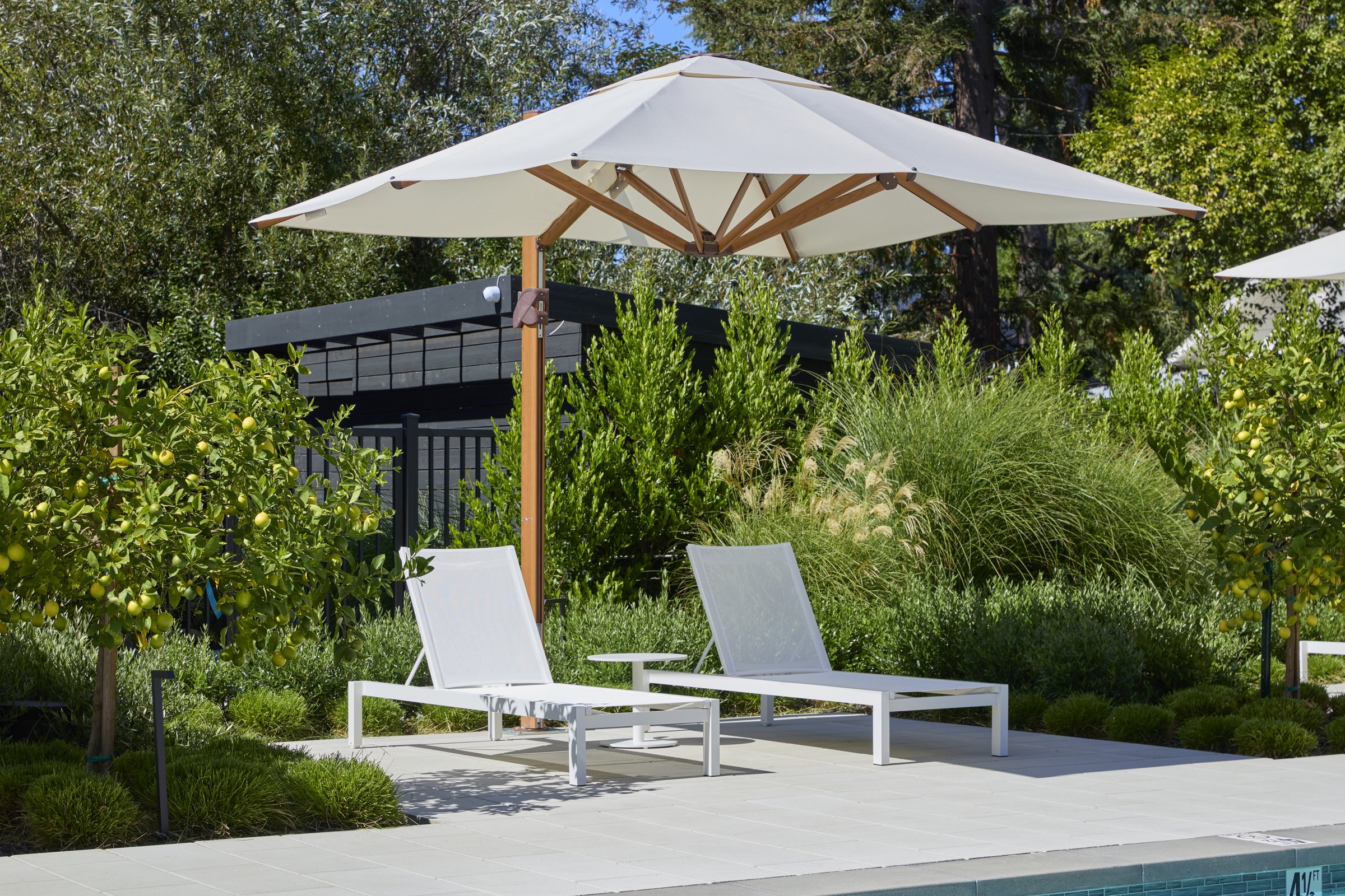 A private chaise patio along the courtyard's garden edge.