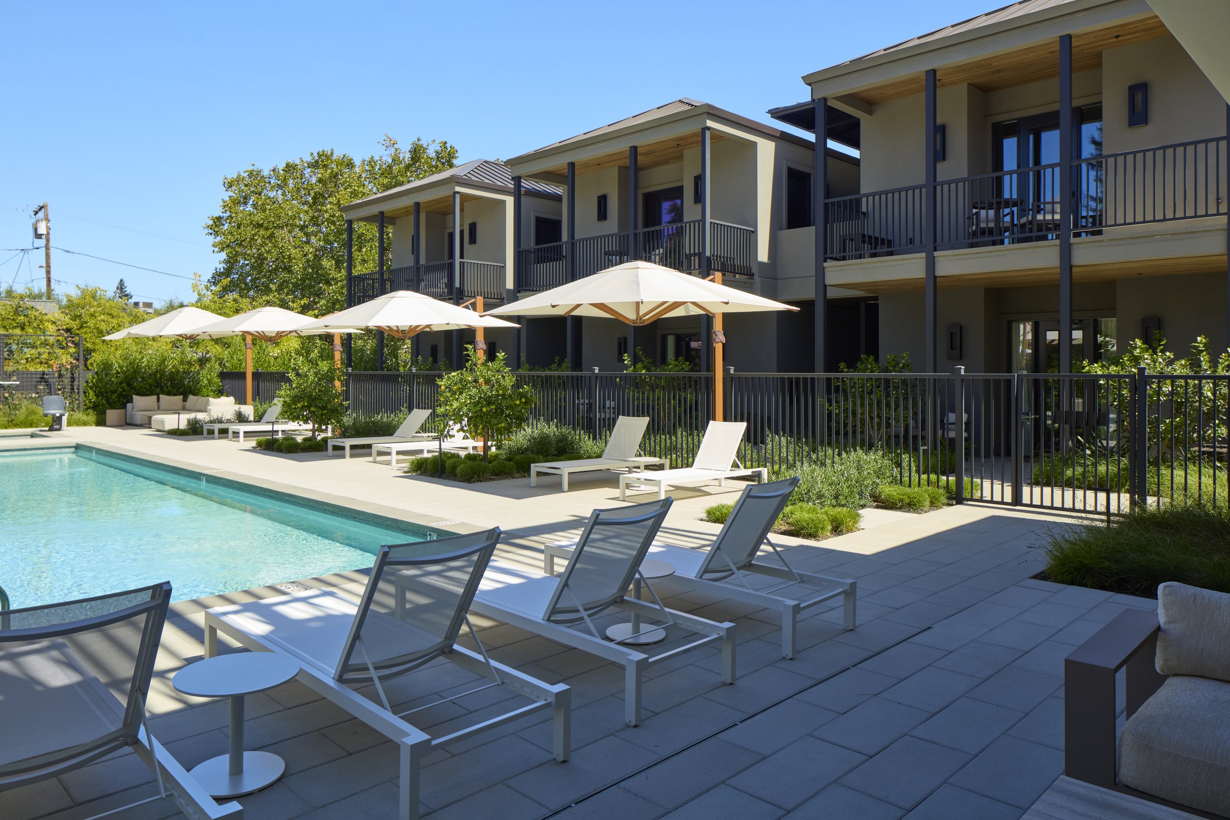 The Poolside Suites building beside the 50' Full Sun Lap Pool.