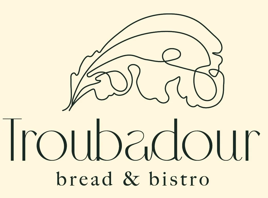 Troubadour Bread & Bistro logo
